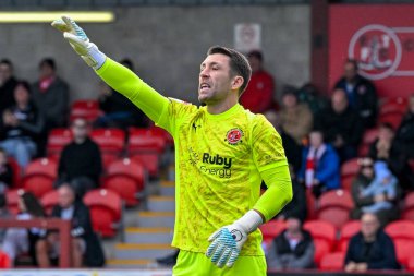 Jay Lynch of Fleetwood Town  with arm raised during the Sky Bet League 2 match Fleetwood Town vs Harrogate Town at Highbury Stadium, Fleetwood, United Kingdom, 11th October 2025