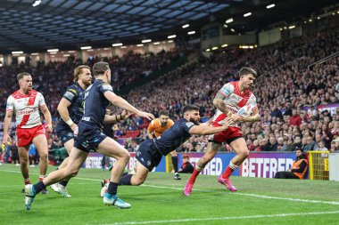 Oliver Gildart of Hull KR is pushed out by Abbas Miski of Wigan Warriors to stop him going over during the 2025 Betfred Super League Grand Final Hull KR v Wigan Warriors at Old Trafford, Manchester, United Kingdom, 11th October 2025 