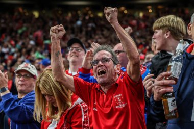 Hull KR fans celebrate a try from Joe Burgess of Hull KR making it 10-0 during the 2025 Betfred Super League Grand Final Hull KR v Wigan Warriors at Old Trafford, Manchester, United Kingdom, 11th October 2025 