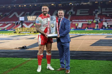 Elliot Minchella of Hull KR and Willie Peters Head Coach of Hull KR with the Grand Final Trophy  during the 2025 Betfred Super League Grand Final Hull KR v Wigan Warriors at Old Trafford, Manchester, United Kingdom, 11th October 2025 