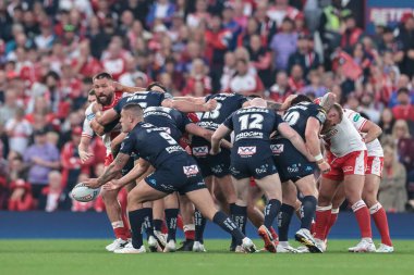 Brad O'neill of Wigan Warriors offloads from a scrum during the 2025 Betfred Super League Grand Final Hull KR v Wigan Warriors at Old Trafford, Manchester, United Kingdom, 11th October 2025