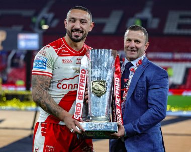 Elliot Minchella of Hull KR and Willie Peters Head Coach of Hull KR With the Grand Final Trophy  during the 2025 Betfred Super League Grand Final Hull KR v Wigan Warriors at Old Trafford, Manchester, United Kingdom, 11th October 2025