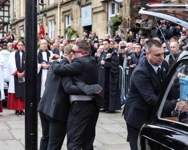 Richard John Hatton MBEs coffin is placed in the hearse by family members after his funeral service has been conducted during Ricky Hatton' Funeral at Manchester Cathedral, Manchester, United Kingdom, 10th October 2025  