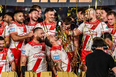 Elliot Minchella of Hull KR drinks from a champagne bottle as his team celebrate winning the Grand Final during the 2025 Betfred Super League Grand Final Hull KR v Wigan Warriors at Old Trafford, Manchester, United Kingdom, 11th October 2025 