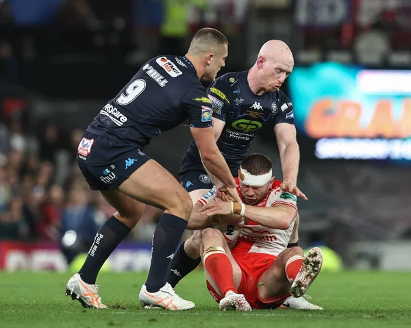 James Batchelor of Hull KR is tackled by Brad O'neill of Wigan Warriors during the 2025 Betfred Super League Grand Final Hull KR v Wigan Warriors at Old Trafford, Manchester, United Kingdom, 11th October 2025