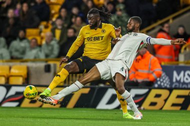 Wolverhampton Wanderers 'dan Tolu Arokodare ve Chelsea' den Tosin Adarabioyo Carabao Kupası son 16 Wolverhampton Wanderers 'a karşı Molineux, Wolverhampton, Birleşik Krallık, 29 Ekim 2025' te oynanan karşılaşmada top için savaştılar. 