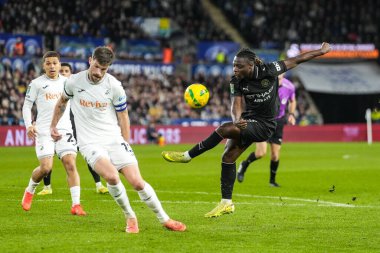 Manchester City 'den Jrmy Doku, 29 Ekim 2025' te Swansea City, Swansea.com Stadyumu 'nda oynanan Carabao Kupası son 16 Swansea City-Manchester City maçında Swansea City' den Cameron Burgess tarafından engellendi. 