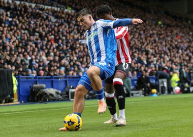 Sheffield Wednesday 'den Harry Amass, Sheffield United' ın Sheffield United maçında Sheffield United 'a karşı 23 Kasım 2025' te Hillsborough, Sheffield, İngiltere 'de oynadığı maçta Andre Brooks' u oyaladı.