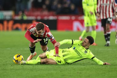 Portsmouth 'dan Jordan Williams, Sheffield United takımının 26 Kasım 2025' te Bramall Lane, Sheffield, Birleşik Krallık 'ta oynanan Sheffield United-Portsmouth maçında Sheffield United takımının rakibi Harrison Burrows' u yere serdi.