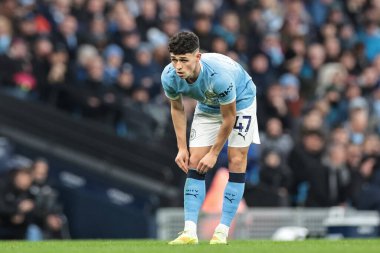 Manchester City 'den Phil Foden, Manchester City' nin 29 Kasım 2025 'te Etihad Stadyumu' nda Leeds United 'a karşı oynadığı Premier League maçında çoraplarını yukarı çekti. 