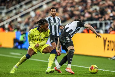 Destiny Udogie of Tottenham Hotspur and Tino Livramento of Newcastle United battle for the ball during the Premier League match Newcastle United vs Tottenham Hotspur at St. James's Park, Newcastle, United Kingdom, 2nd December 2025 