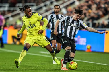 Tino Livramento of Newcastle United and Destiny Udogie of Tottenham Hotspur battle for the ball during the Premier League match Newcastle United vs Tottenham Hotspur at St. James's Park, Newcastle, United Kingdom, 2nd December 2025 