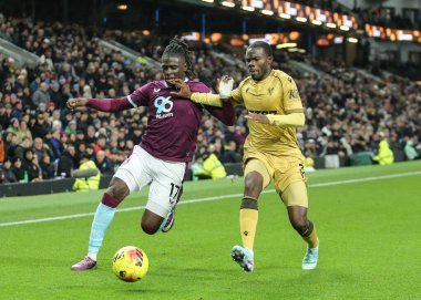 Loum Tchaouna of Burnley and Tyrick Mitchell of Crystal Palace battle for the ball during the Premier League match Burnley vs Crystal Palace at Turf Moor, Burnley, United Kingdom, 3rd December 2025 