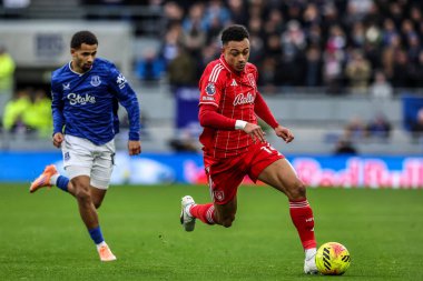 Dan Ndoye of Nottingham Forest breaks with the ball under pressure from Iliman Ndiaye of Everton during the Premier League match Everton vs Nottingham Forest at Hill Dickinson Stadium, Liverpool, United Kingdom, 6th December 2025 
