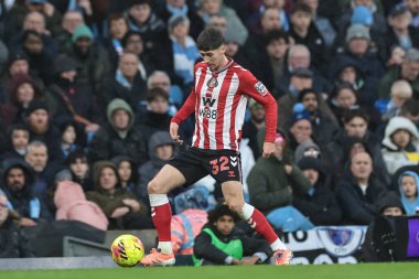 Trai Hume of Sunderland with the ball during the Premier League match Manchester City vs Sunderland at Etihad Stadium, Manchester, United Kingdom, 6th December 2025 