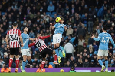 Ruben Dias of Manchester City jumps up to win the high ball during the Premier League match Manchester City vs Sunderland at Etihad Stadium, Manchester, United Kingdom, 6th December 2025 