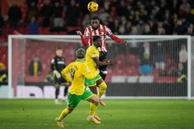 Japhet Tanganga of Sheffield United jumps and heads the ball away during the Sky Bet Championship match Sheffield United vs Norwich City at Bramall Lane, Sheffield, United Kingdom, 9th December 2025 