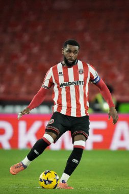 Sheffield United takımından Japhet Tanganga, 9 Aralık 2025 'te Bramall Lane, Sheffield, İngiltere' de oynanan Sheffield United Norwich City maçında topu sürüyor. 