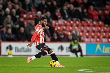 Sheffield United takımından Japhet Tanganga, 9 Aralık 2025 'te Bramall Lane, Sheffield, İngiltere' de oynanan Sheffield United Norwich City maçında topu geçmeye hazırlanıyor. 