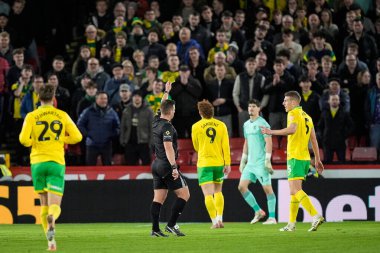 Refere Josh Smith shows a yellow car to a Norwich City player during the Sky Bet Championship match Sheffield United vs Norwich City at Bramall Lane, Sheffield, United Kingdom, 9th December 2025 