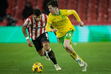 Kellen Fisher of Norwich City runs with the ball as Gustavo Hamer of Sheffield United chases during the Sky Bet Championship match Sheffield United vs Norwich City at Bramall Lane, Sheffield, United Kingdom, 9th December 2025 