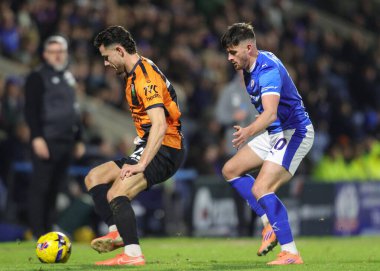 Nikola Tavares of Barnet holds off Lee Bonis of Chesterfield during the Sky Bet League 2 match Chesterfield vs Barnet at SMH Group Stadium, Chesterfield, United Kingdom, 13th December 2025