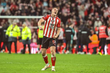 Daniel Ballard of Sunderland celebrates the win during the Premier League match Sunderland vs Newcastle United at Stadium Of Light, Sunderland, United Kingdom, 14th December 2025