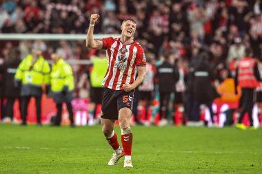 Daniel Ballard of Sunderland celebrates the win during the Premier League match Sunderland vs Newcastle United at Stadium Of Light, Sunderland, United Kingdom, 14th December 2025