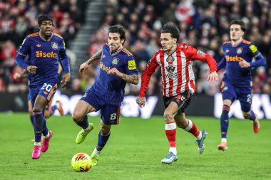 Enzo Le Fee of Sunderland breaks with the ball under pressure from Sandro Tonali of Newcastle United during the Premier League match Sunderland vs Newcastle United at Stadium Of Light, Sunderland, United Kingdom, 14th December 2025
