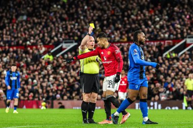 Referee Simon Hooper gives a yellow card to Casemiro of Manchester Untied during the Premier League match Manchester United vs Bournemouth at Old Trafford, Manchester, United Kingdom, 15th December 2025