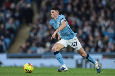 Manchester City 'den Phil Foden, 20 Aralık 2025' te Etihad Stadyumu 'nda Manchester City ile West Ham United arasındaki Premier League maçında topa vurdu.