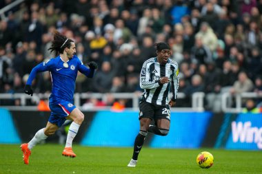 Anthony Elanga of Newcastle United runs with the ball as Marc Cucurella of Chelsea chases during the Premier League match Newcastle United vs Chelsea at St. James's Park, Newcastle, United Kingdom, 20th December 2025