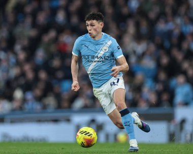 Manchester City 'den Phil Foden, 20 Aralık 2025' te Etihad Stadyumu 'nda Manchester City ile West Ham United arasındaki Premier League maçında topa vurdu.
