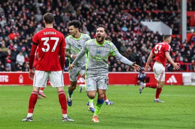 Manchester City 'den Rayan Cherki, 27 Aralık 2025' te İngiltere 'nin Nottingham kentinde oynanan Premier League maçında Nottingham Forest' a karşı Manchester City maçında 1-2 'lik galibiyetini kutluyor.
