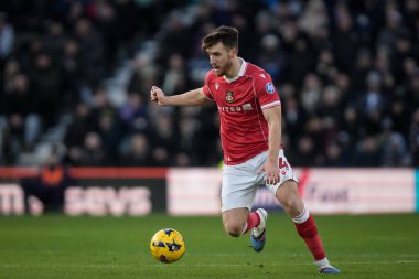 George Thomason of Wrexham makes a run with the ball during the Sky Bet Championship match Derby County vs Wrexham at Pride Park Stadium, Derby, United Kingdom, 4th January 2026