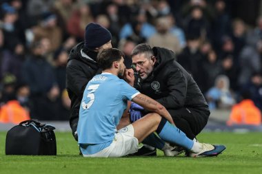 Ruben Dias of Manchester City receives treatment during the Premier League match Manchester City vs Chelsea at Etihad Stadium, Manchester, United Kingdom, 4th January 2026