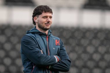 Liberato Cacace of Wrexham inspects the pitch prior to kick off during the Sky Bet Championship match Derby County vs Wrexham at Pride Park Stadium, Derby, United Kingdom, 4th January 2026