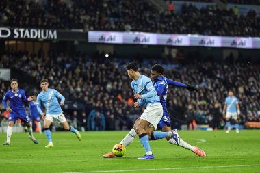 Tijjani Reijnders of Manchester City is tackled by Josh Acheampong of Chelsea during the Premier League match Manchester City vs Chelsea at Etihad Stadium, Manchester, United Kingdom, 4th January 2026