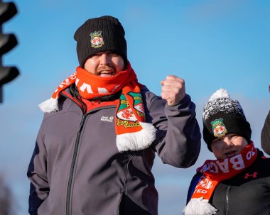 A Wrexham fan walks towards the stadium prior to kick off during the Sky Bet Championship match Derby County vs Wrexham at Pride Park Stadium, Derby, United Kingdom, 4th January 2026