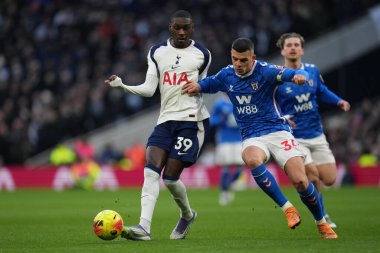 Randal Kolo Muani of Tottenham Hotspur plays pass under pressure from Granit Xhaka of Sunderland during the Premier League match Tottenham Hotspur vs Sunderland at Tottenham Hotspur Stadium, London, United Kingdom, 4th January 2026