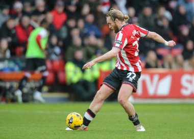 Sheffield United takımından Tom Davies, Sheffield Lane, Sheffield, Birleşik Krallık 'ta Sheffield United ile Ipswich Town arasındaki 24 Ocak 2026' da oynanan Gökyüzü İddia Şampiyonası maçında pas attı.