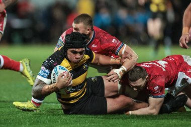 Xavier Vaa of York Knights is tackled by James Batchelor of Hull KR during the Betfred Super League Round 1 match York Knights vs Hull KR at LNER Community Stadium, Lincoln, United Kingdom on 12 February 2026