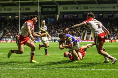 Warrington Wolves 'tan Toby King, 13 Şubat 2026 tarihinde Warrington, İngiltere' deki Halliwell Jones Stadyumu 'nda oynanan Warrington Wolves-St Helens maçında bir deneme için sahaya çıkıyor.