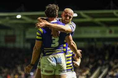 Warrington Wolves 'tan Toby King, 13 Şubat 2026 tarihinde Warrington, İngiltere' deki Halliwell Jones Stadyumu 'nda oynanan Warrington Wolves-St Helens maçında bir deneme için sahaya çıkıyor.