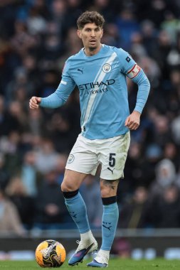 Manchester City 'den John Stones, 14 Şubat 2026 tarihinde İngiltere' nin Etihad Stadyumu 'nda oynanan 4.
