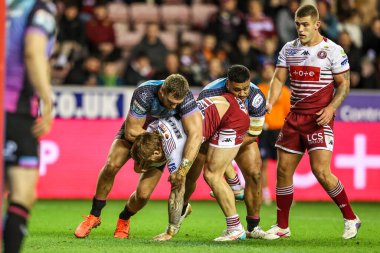 Adam Keighran of Wigan Warriors is tackled during the Betfred Super League match Wigan Warriors vs Hull FC at The Brick Community Stadium, Wigan, United Kingdom on 21 February 2026
