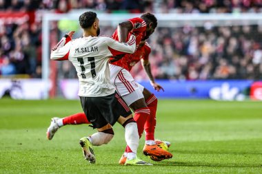 Mohamed Salah of Liverpool is tackled by Ibrahim Sangare of Nottingham Forest during the Premier League match Nottingham Forest vs Liverpool at City Ground, Nottingham, United Kingdom on 22 February 2026