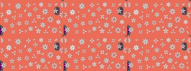 Turuncu ve nötr renklerde parlak çiçekli halı deseni.