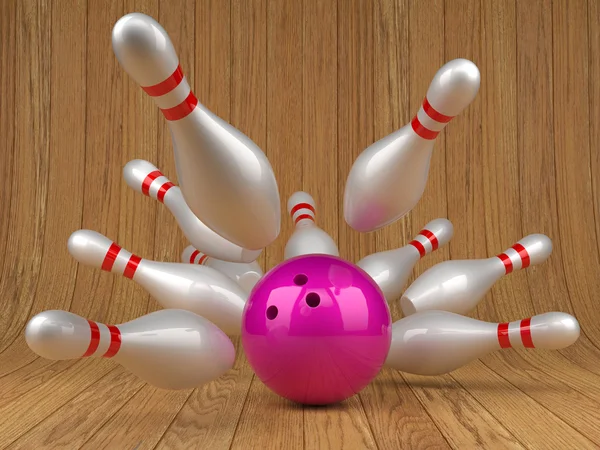 Bowling ball and scattered skittles — Stockfoto