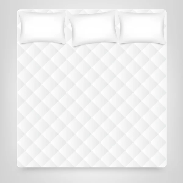 Üç yastık beyaz yatak